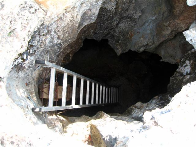 cave with ladder entrance